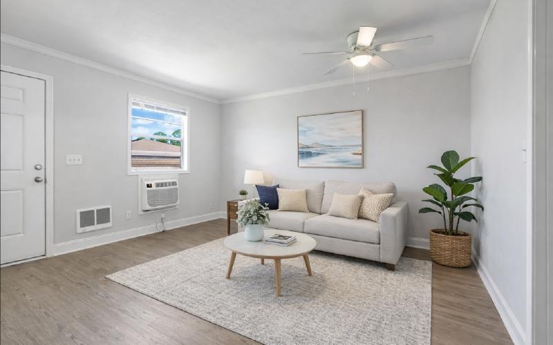 a living room with a couch and a table