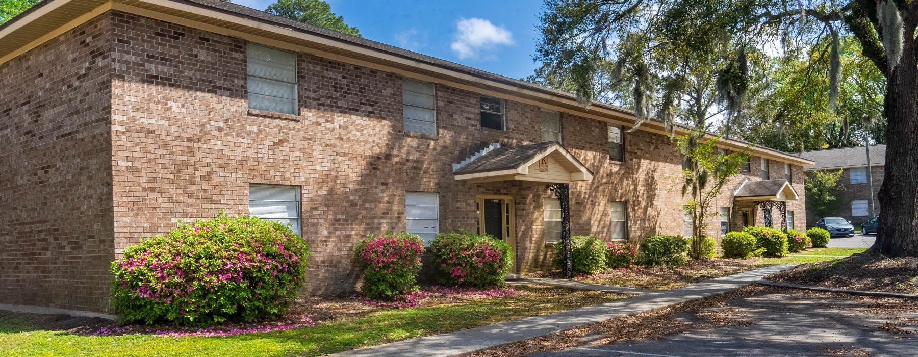 a brick building with a driveway
